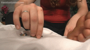 A group of tiny people find themselves shrunken on a bed with Vashti. She toys with them, picking them up, sticking them between her toes and playing with some along her sole before flicking them away. The couple left are squished under her hand and between her fingers before being forgotten in her palm. A mix of hand and feet interaction in this one. 4min 56sec.
