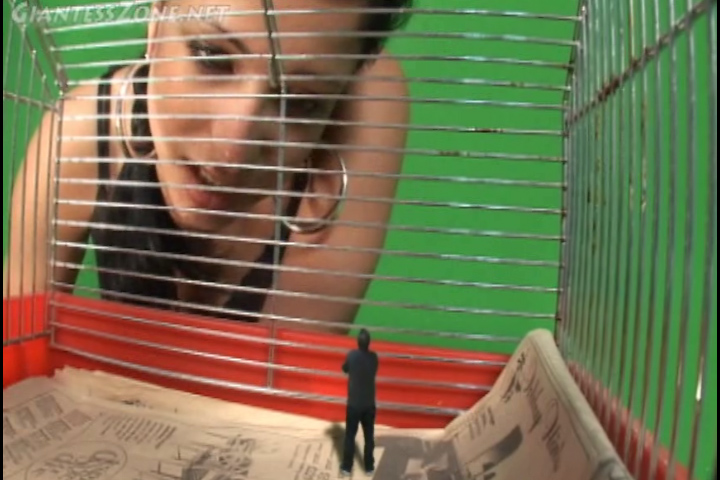 <p>Caged Life Michelle has a tiny man trapped in a cage and she is explaining to him what his new life as her pet</p>
